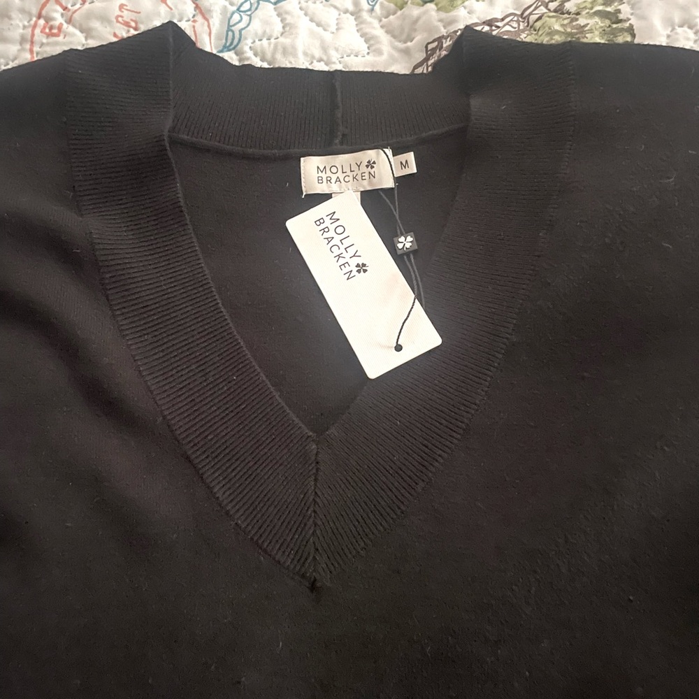 Rich black Molly Bracken sleeveless sweater. Women’s size M. New with tags.